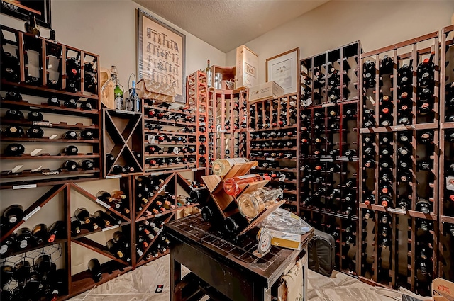 wine room with a textured ceiling