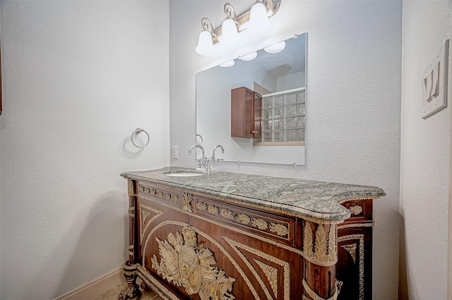 bathroom featuring vanity and baseboards