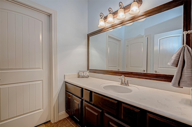 bathroom with tile patterned flooring and vanity