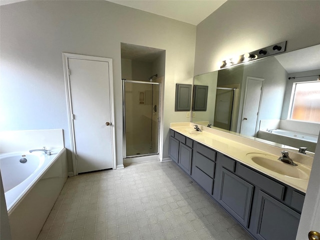 bathroom with vanity and independent shower and bath