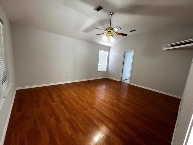 interior space with vaulted ceiling, ceiling fan, and dark hardwood / wood-style flooring