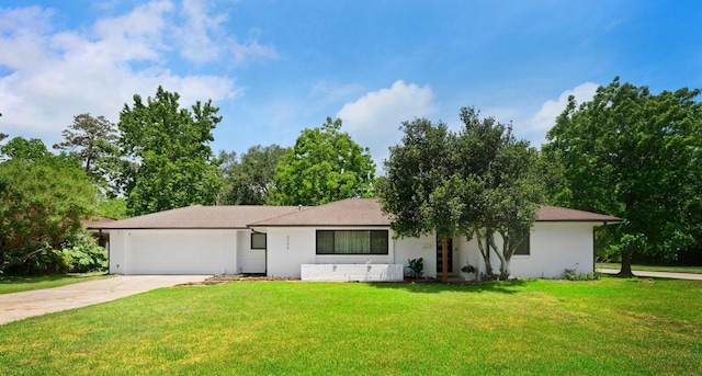 single story home with a garage and a front yard