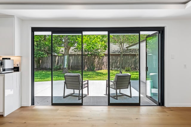 doorway to outside with light hardwood / wood-style floors