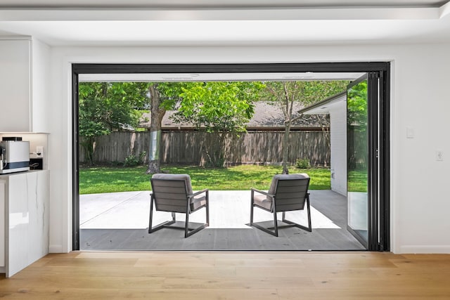 entryway featuring plenty of natural light and light hardwood / wood-style floors