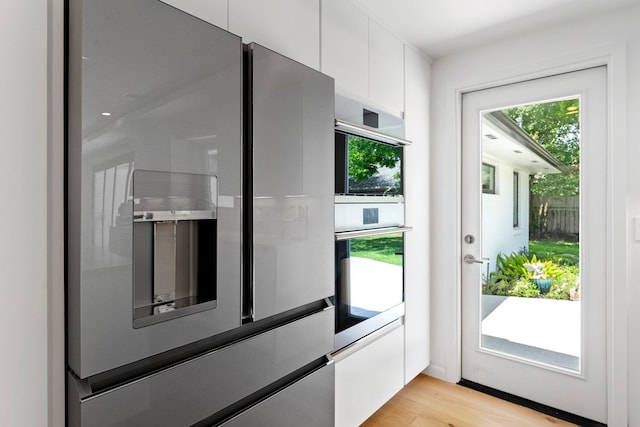 doorway to outside featuring light hardwood / wood-style floors