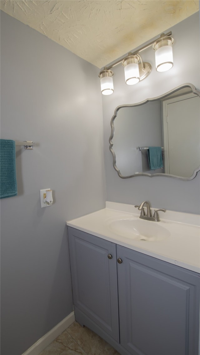 bathroom featuring vanity and a textured ceiling