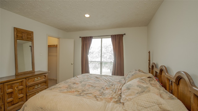 bedroom featuring a closet and a textured ceiling