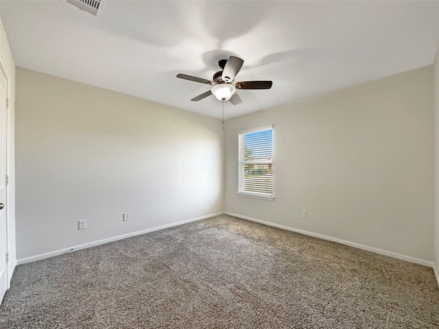 unfurnished room with ceiling fan and carpet flooring