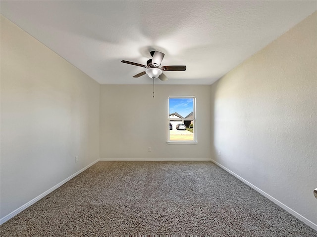 unfurnished room with ceiling fan, carpet, and a textured ceiling