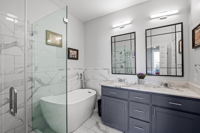 bathroom with plus walk in shower, tile walls, and vanity