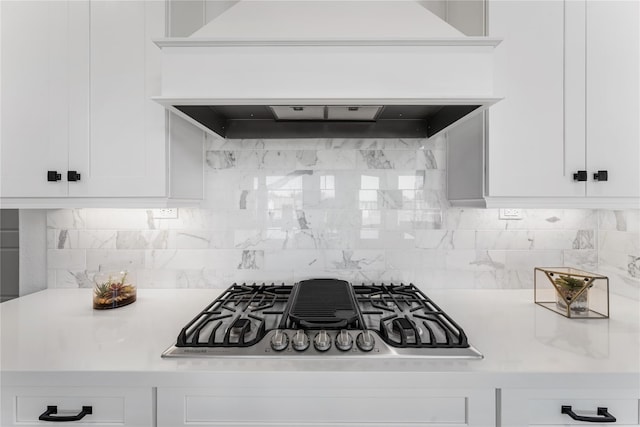 kitchen featuring stainless steel gas cooktop and white cabinets