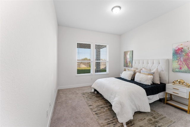 bedroom featuring light carpet