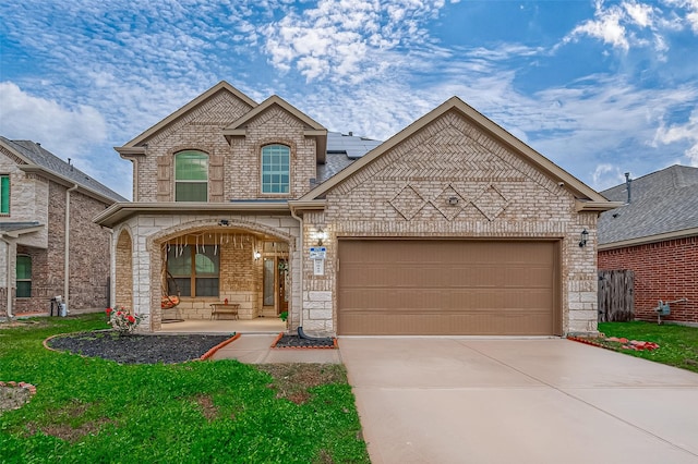 view of front of house with a garage and covered porch