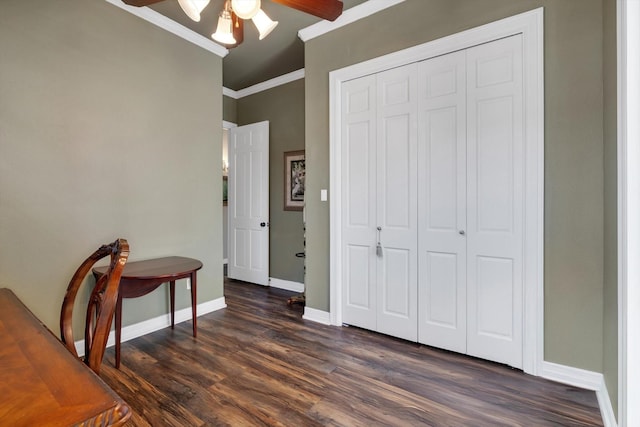 interior space with crown molding, ceiling fan, and dark hardwood / wood-style flooring