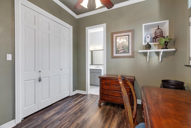 office featuring ornamental molding, ceiling fan, and dark hardwood / wood-style flooring