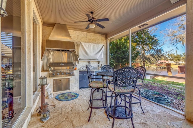 sunroom with wood ceiling and ceiling fan