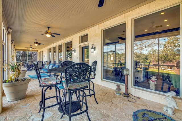 view of patio featuring ceiling fan