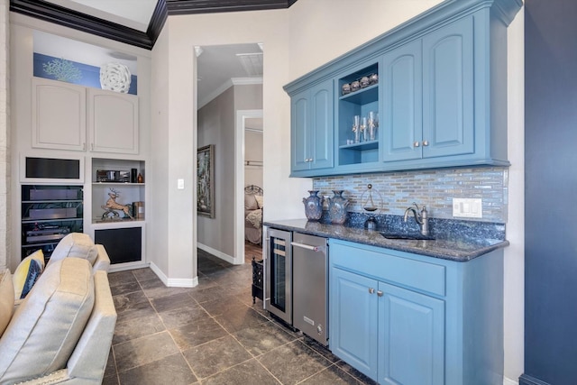 bar featuring tasteful backsplash, sink, wine cooler, ornamental molding, and blue cabinetry