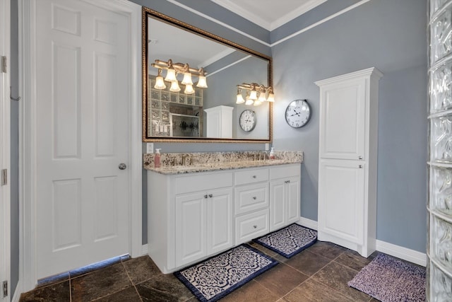 bathroom featuring crown molding, vanity, and walk in shower