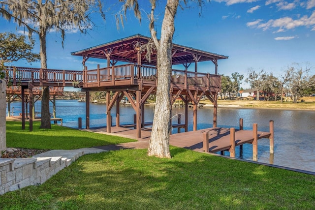 dock area featuring a gazebo, a water view, and a lawn