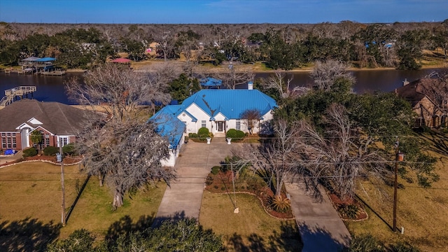 birds eye view of property with a water view