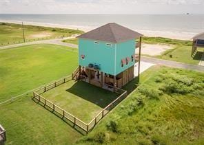 view of storm shelter featuring a water view and a rural view