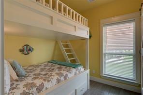 bedroom with dark hardwood / wood-style floors