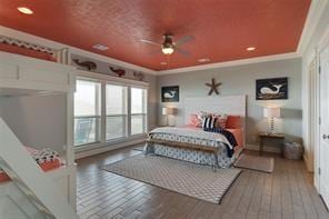 bedroom with crown molding and wood-type flooring