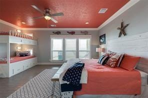 bedroom featuring crown molding and hardwood / wood-style floors