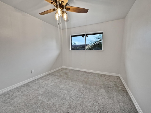 empty room featuring carpet floors and ceiling fan