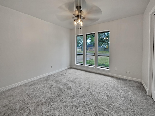 spare room with carpet floors and ceiling fan