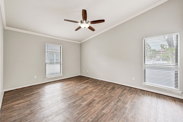 empty room featuring crown molding, vaulted ceiling, dark hardwood / wood-style floors, and ceiling fan