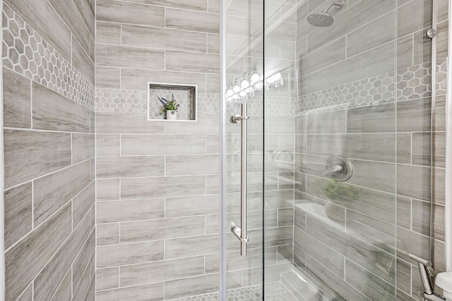 bathroom featuring an enclosed shower