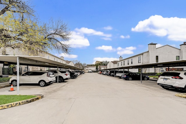 view of vehicle parking with a carport