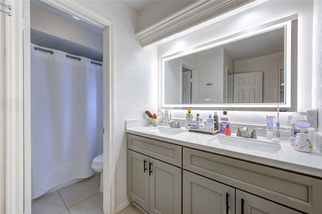 bathroom with tile patterned flooring, vanity, a shower with curtain, and toilet