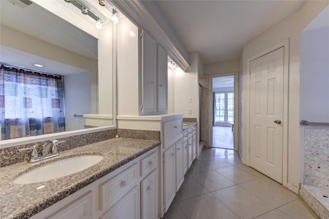 bathroom with tile patterned flooring and sink