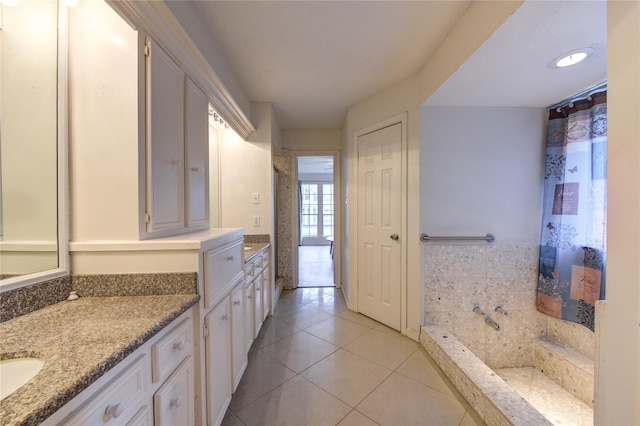 bathroom with vanity and tile patterned flooring