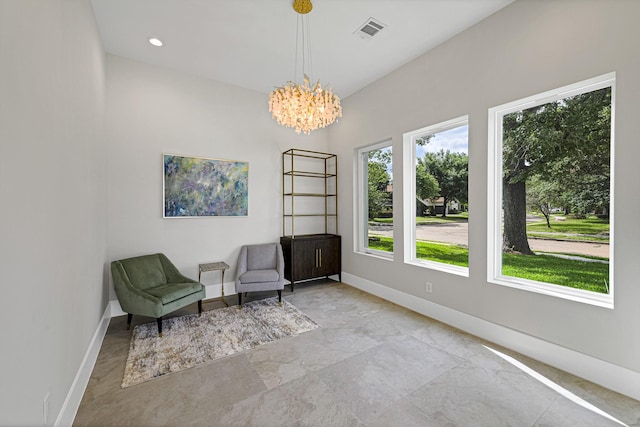 unfurnished room featuring a chandelier