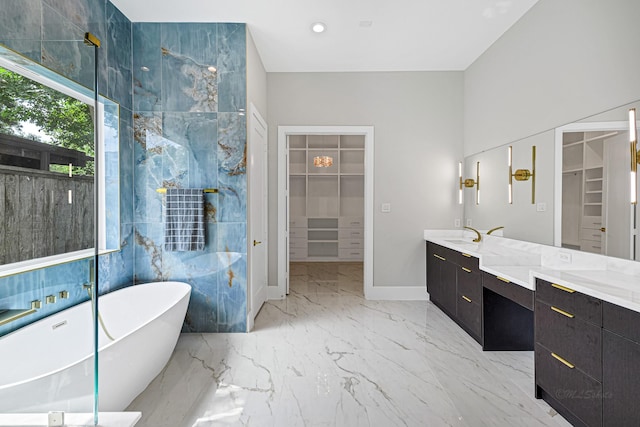 bathroom featuring vanity and a tub