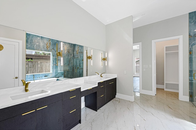 bathroom with an enclosed shower, vanity, and high vaulted ceiling