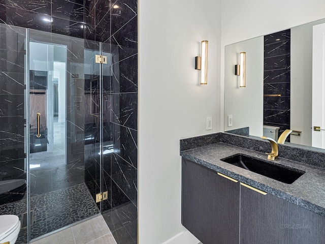 bathroom featuring walk in shower, vanity, and toilet