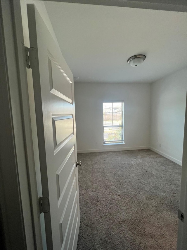 empty room with carpet flooring