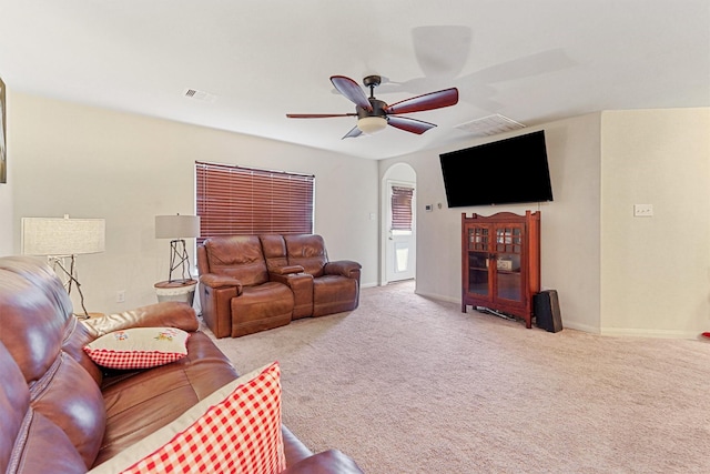 living room featuring light carpet and ceiling fan