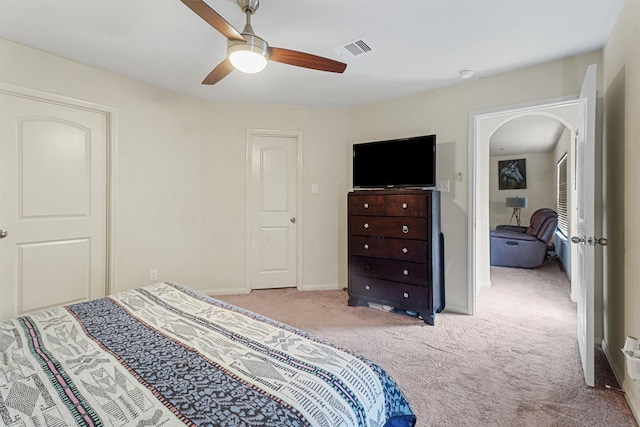 carpeted bedroom with ceiling fan