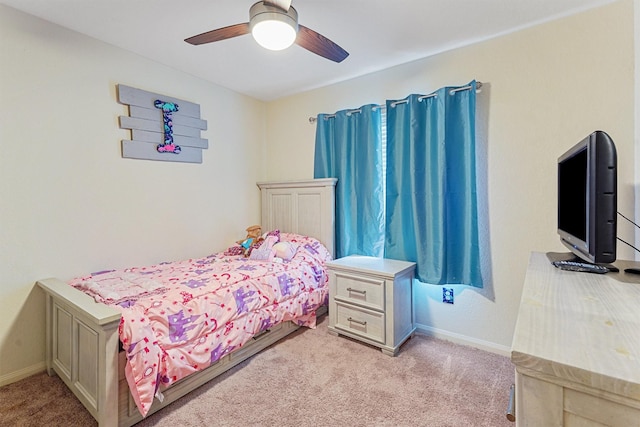 bedroom with light carpet and ceiling fan