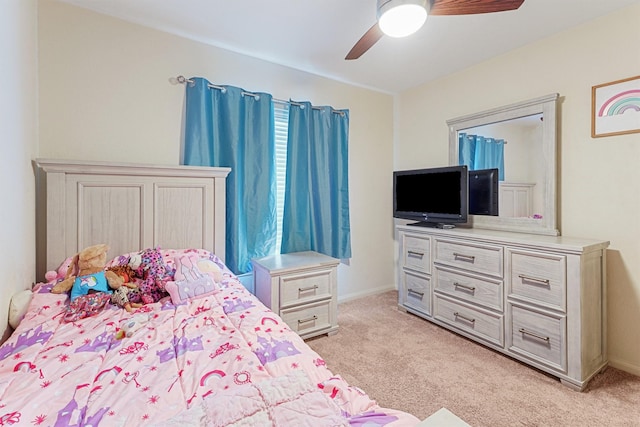 bedroom featuring light carpet and ceiling fan