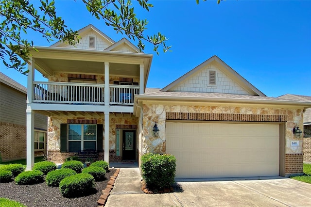 view of front of home featuring a garage, a balcony, and a porch