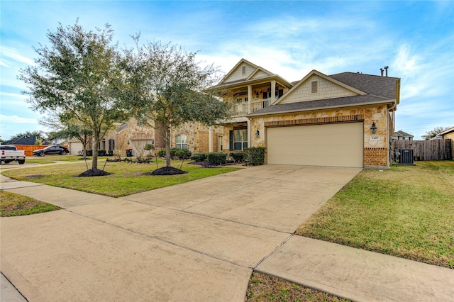 view of front of house featuring a balcony, a front lawn, and central air condition unit