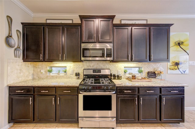 kitchen featuring tasteful backsplash, crown molding, dark brown cabinets, and appliances with stainless steel finishes