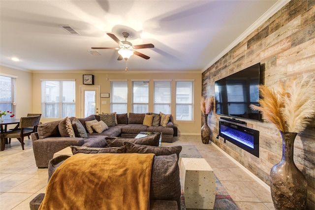 living room with light tile patterned flooring, ceiling fan, and ornamental molding